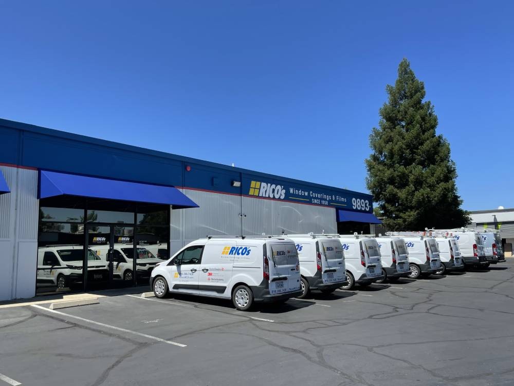 Our fleet of Rico’s Window Coverings and Films vans outside the building near Sacramento, California (CA)